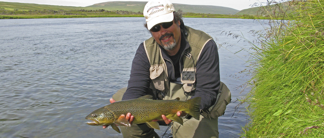 Fly fishing for brown trout in the Laxá River in Iceland